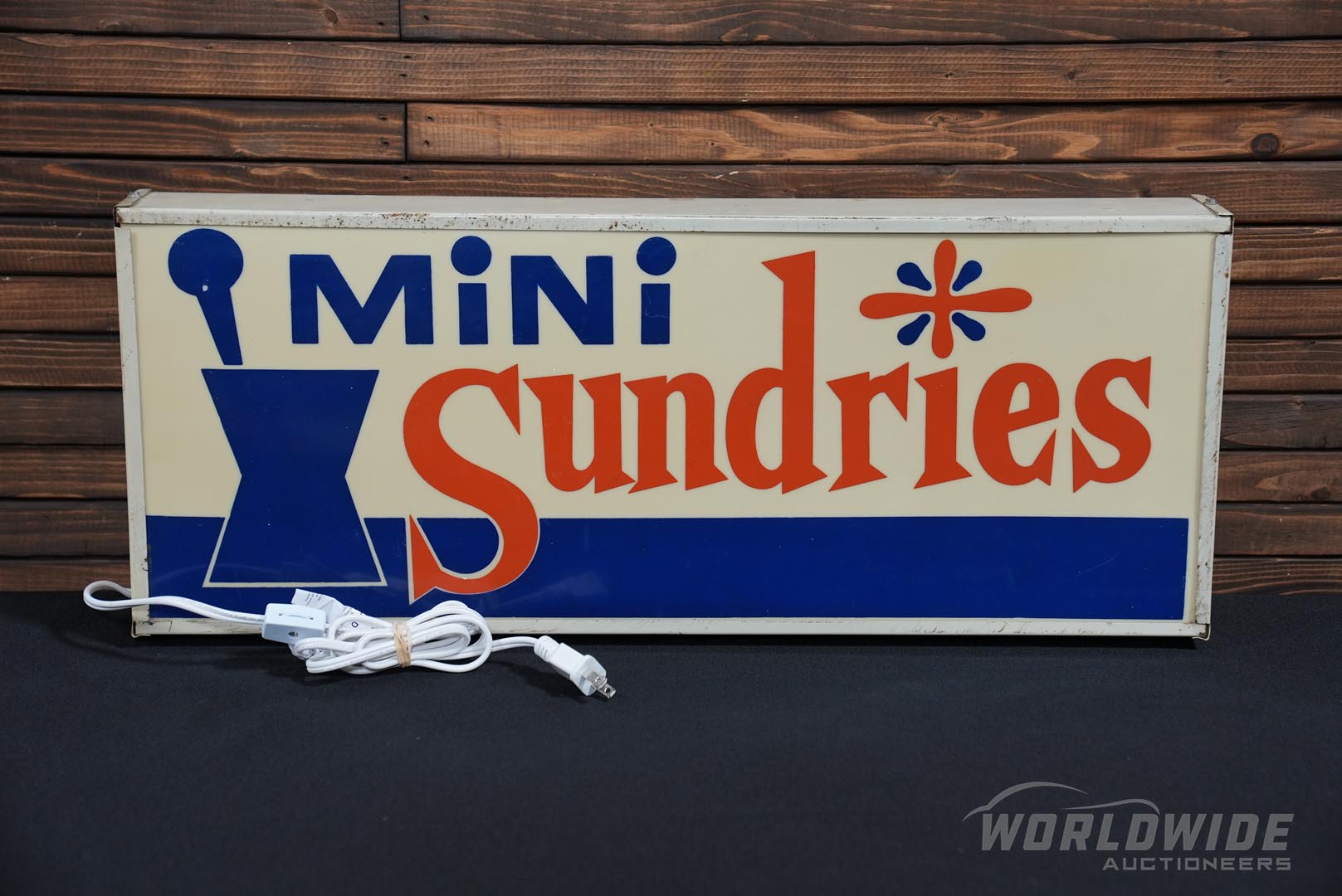 1960s Mini Sundries Lighted Si gn 